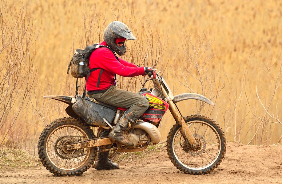 man seated on a motorbike